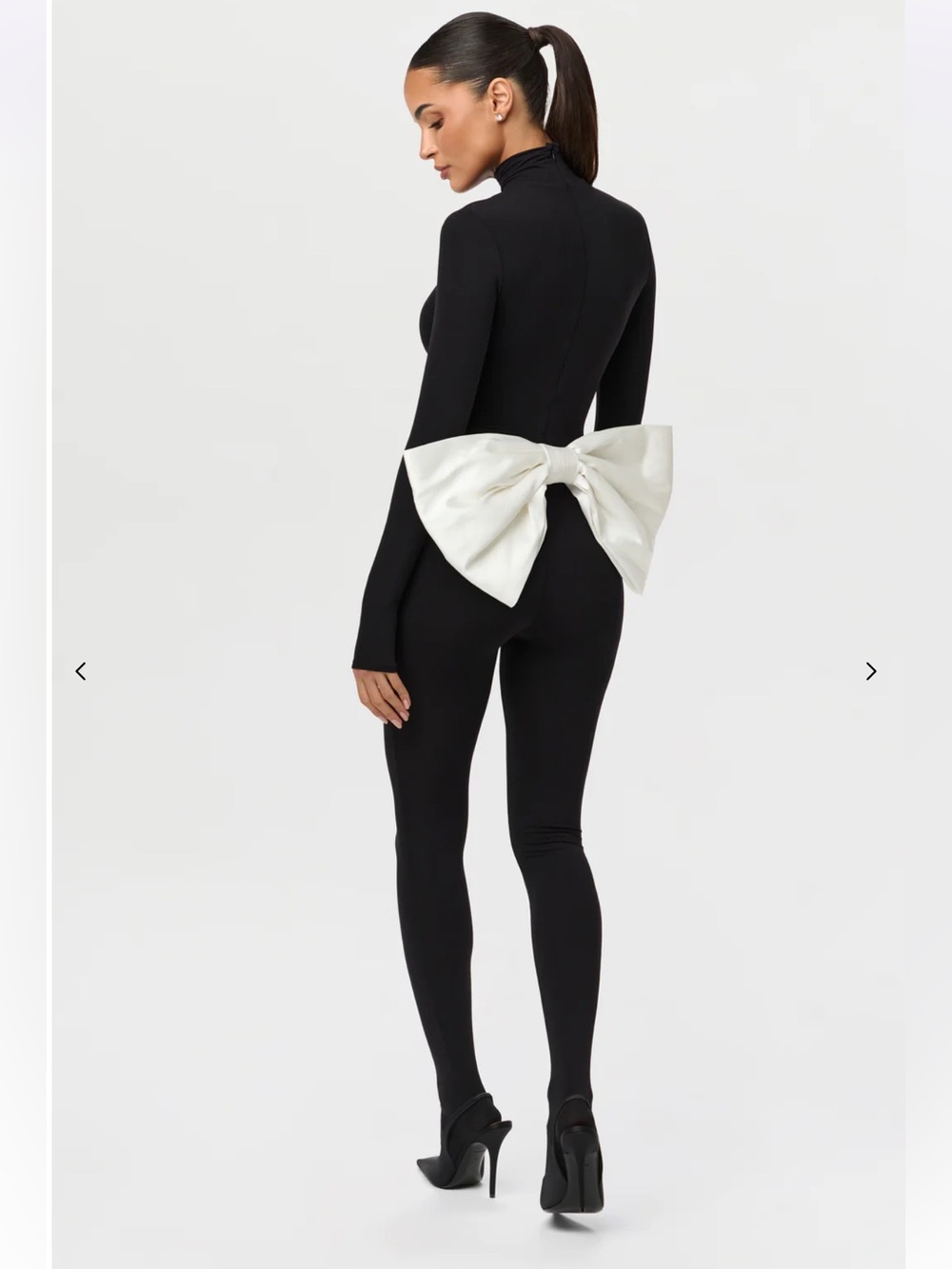 Naked Wardrobe $128 (current) NAKED JUMPSUIT WITH BOW in black